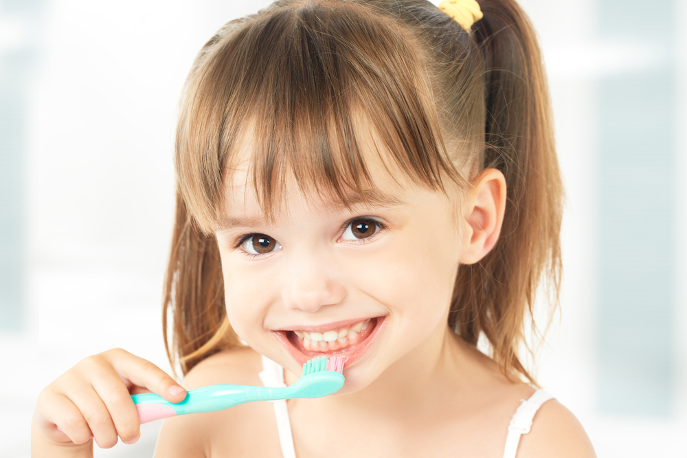 A child using a toothbrush