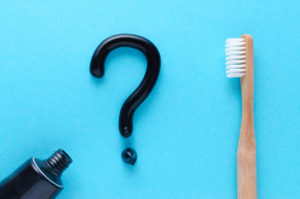 charcoal toothpaste and toothbrush question mark