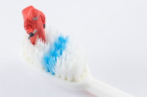 scientist-inspecting-cleaning-toothbrush