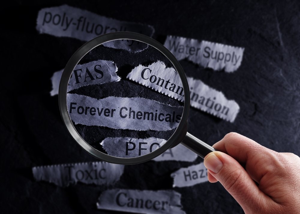 Newspaper clippings of words associated with PFAS and PFOA including toxic, cancer, and forever chemicals