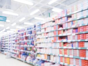 Blurred supermarket toothpaste aisle