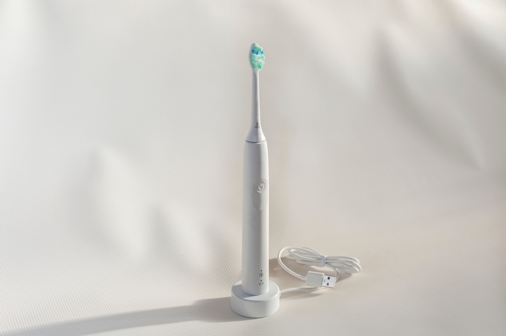 Sonic toothbrush set against a white background
